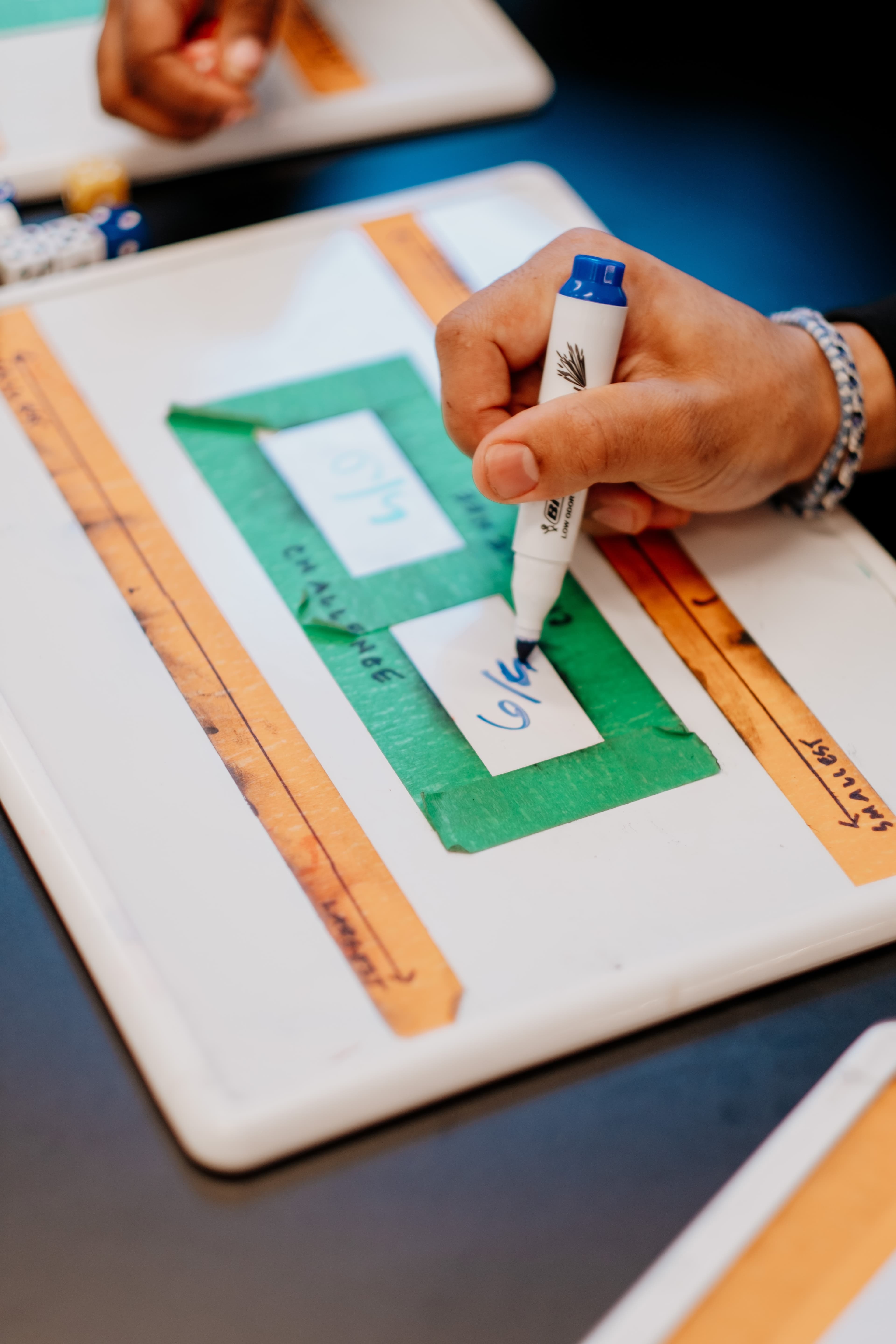 person writing fractions